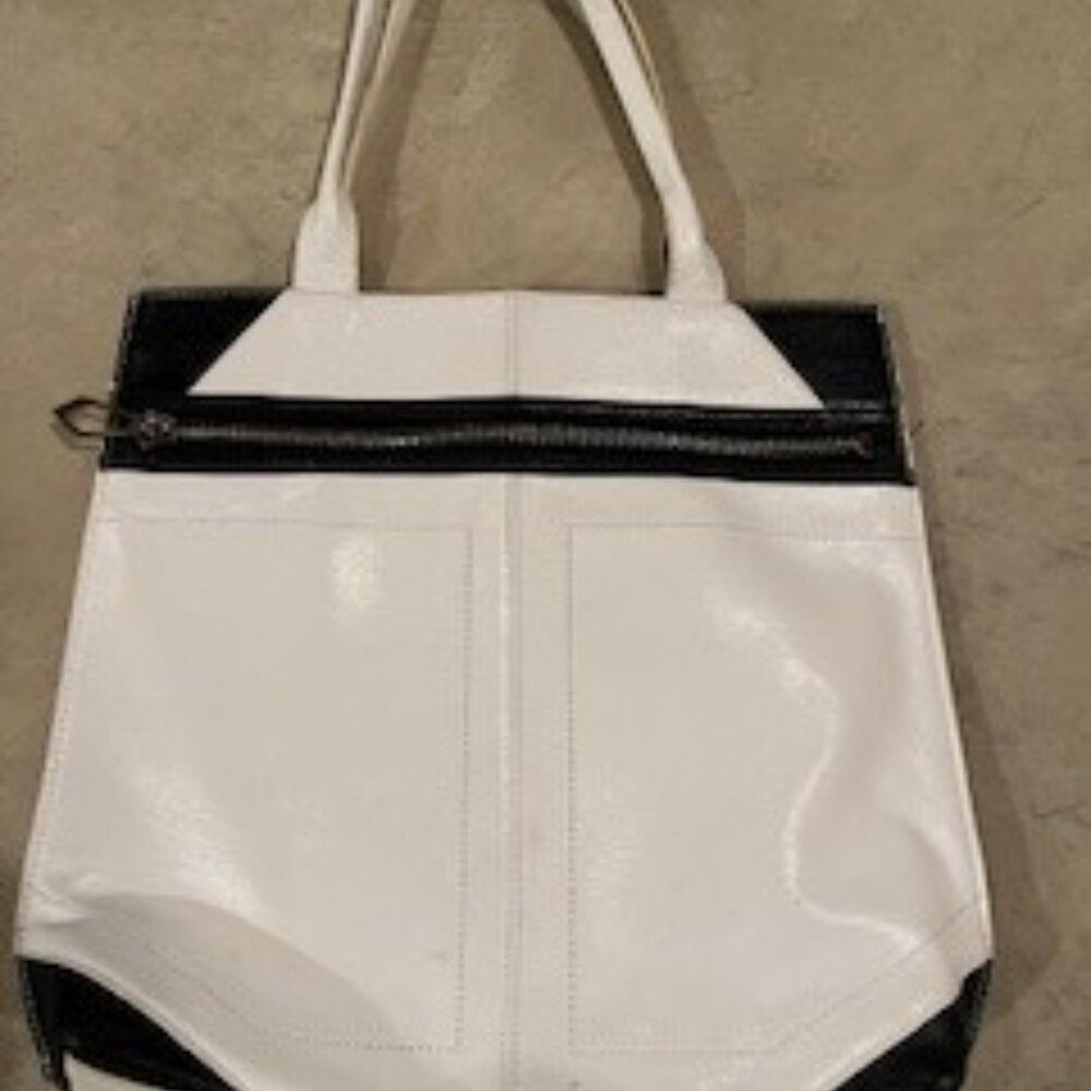 White and black leather shoulder bag with beautiful fucshia interior